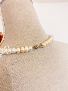 Collana perle e fiocco