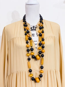 Medium length ethnic necklace.