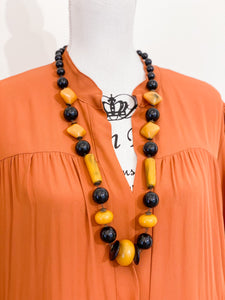 Medium length ethnic necklace.