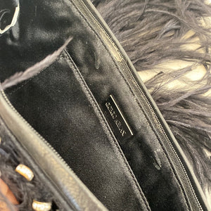 Clutch bag with feathers
