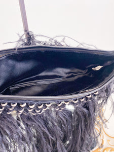 Clutch bag with feathers