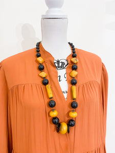 Medium length ethnic necklace.