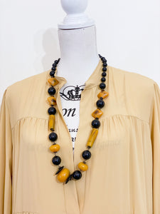 Medium length ethnic necklace.