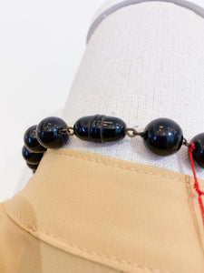 Medium length ethnic necklace.