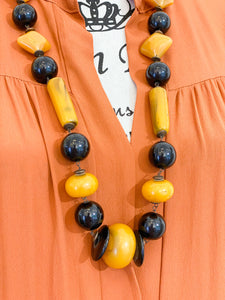 Medium length ethnic necklace.
