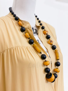 Medium length ethnic necklace.